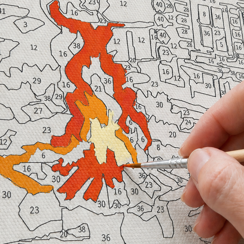 Hand painting a numbered section on canvas